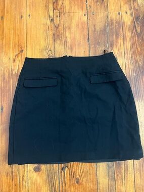 Babaton Black Mini Skirt with Flap Pockets